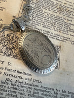 Locket on Chain. Antique silver Oval locket.