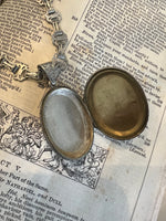 Locket on Chain. Antique silver Oval locket.